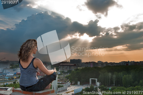 Image of Attractive girl meditating at sunbeam