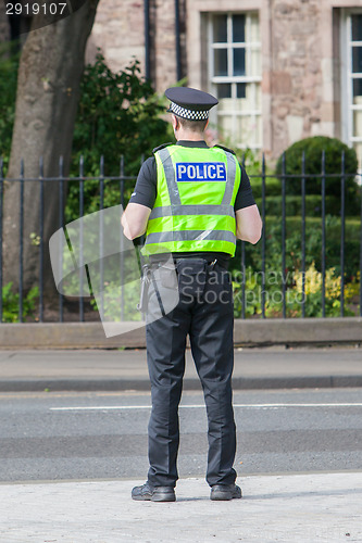Image of EDINBURGH, SCOTLAND - JULY 21: Police officer on guard duty near
