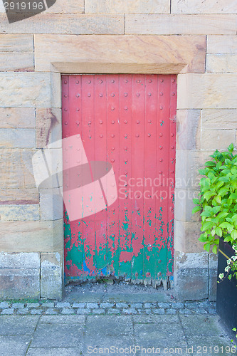 Image of Very rustic green and red door