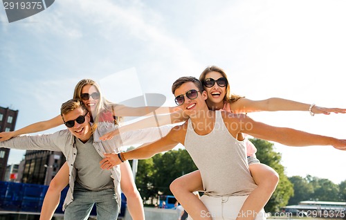 Image of smiling couple having fun in city