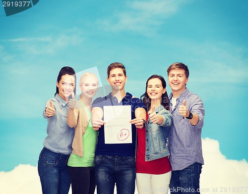 Image of group of students showing test and thumbs up