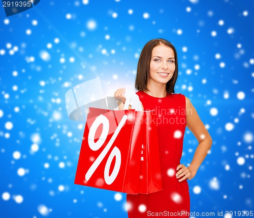Image of woman in red dress with shopping bags