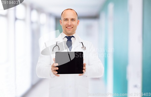 Image of smiling male doctor with tablet pc and stethoscope