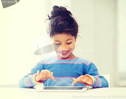 Image of girl with tablet pc at home
