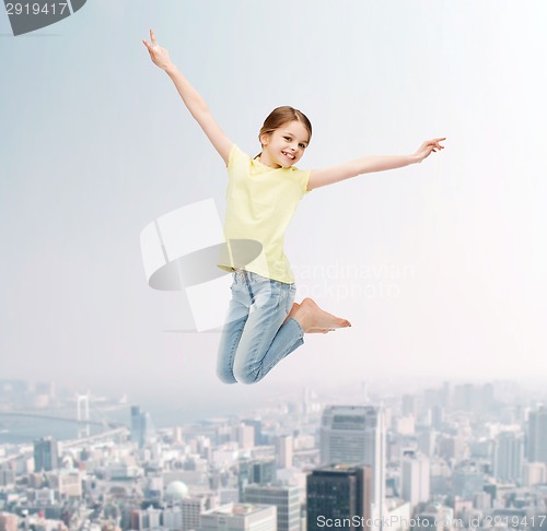 Image of smiling little girl jumping