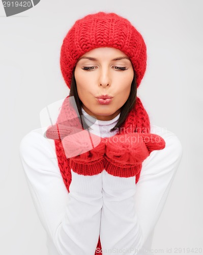 Image of smiling young woman in winter clothes