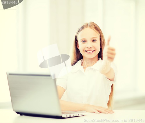 Image of girl with laptop pc at school