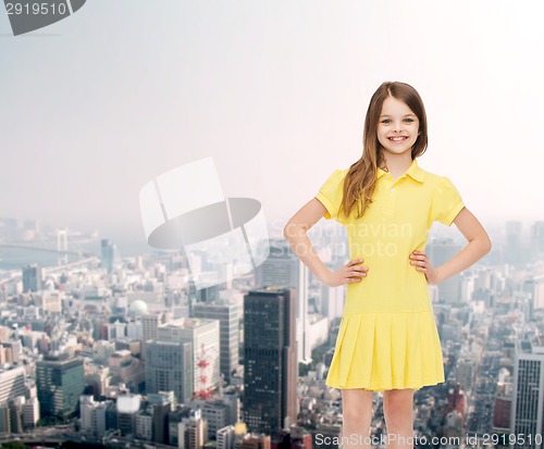 Image of smiling little girl in yellow dress