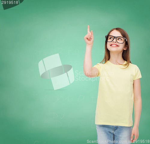 Image of smiling cute little girl in black eyeglasses