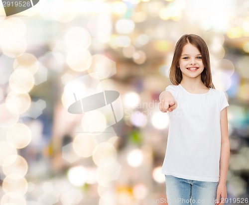 Image of smiling little girl in white blank t-shirt