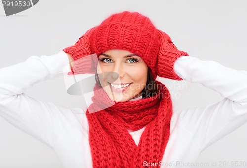 Image of smiling young woman in winter clothes