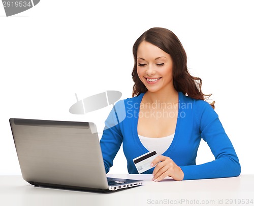 Image of happy woman with laptop computer and credit card