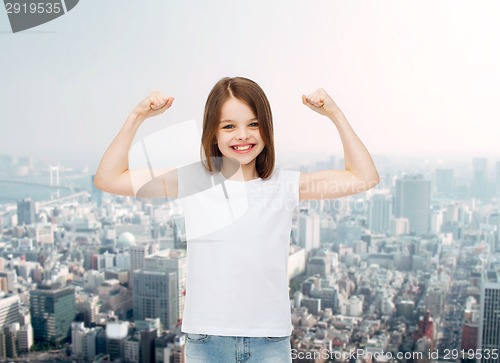 Image of smiling little girl in white blank t-shirt