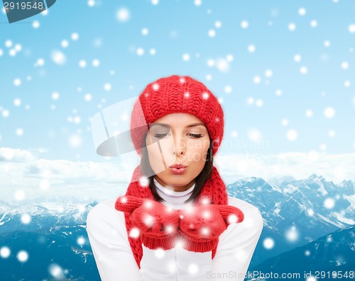 Image of smiling young woman in winter clothes