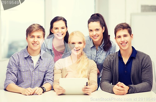 Image of smiling students with tablet pc at school