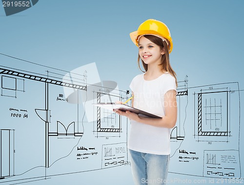 Image of smiling little girl in hardhat with clipboard