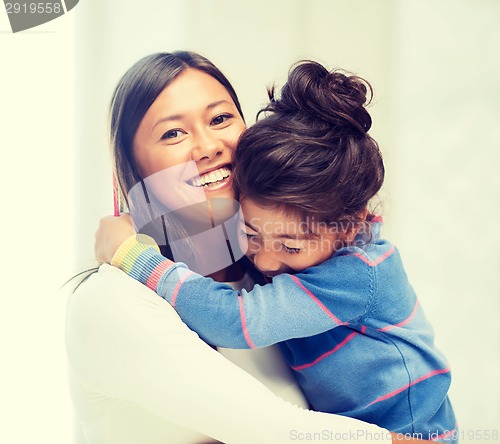 Image of hugging mother and daughter