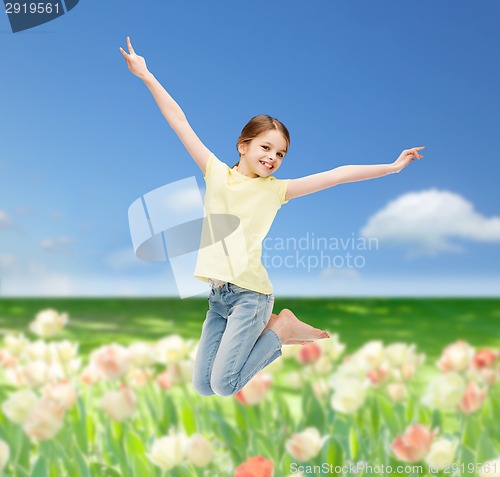 Image of smiling little girl jumping