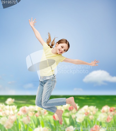 Image of smiling little girl jumping