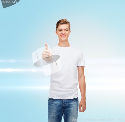 Image of smiling man in white t-shirt showing thumbs up