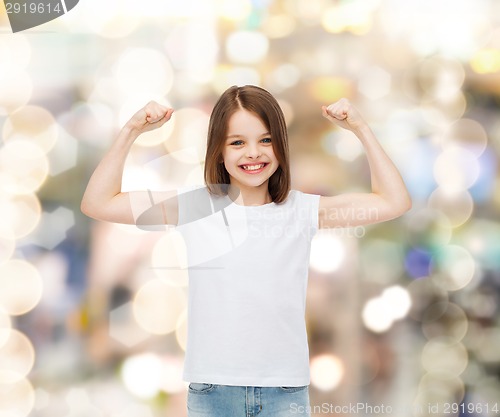 Image of smiling little girl in white blank t-shirt