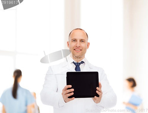 Image of smiling male doctor with tablet pc