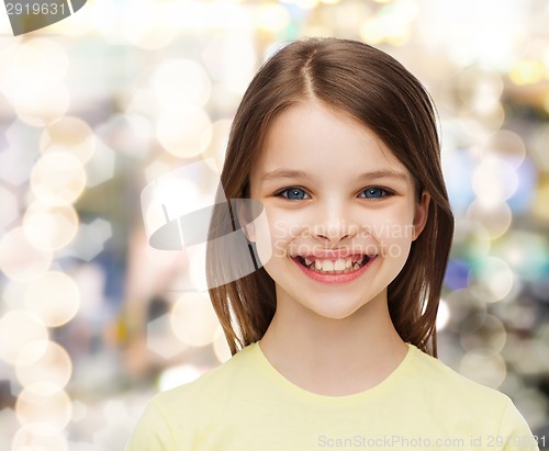 Image of smiling little girl over white background