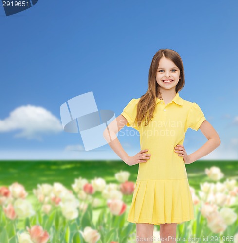 Image of smiling little girl in yellow dress