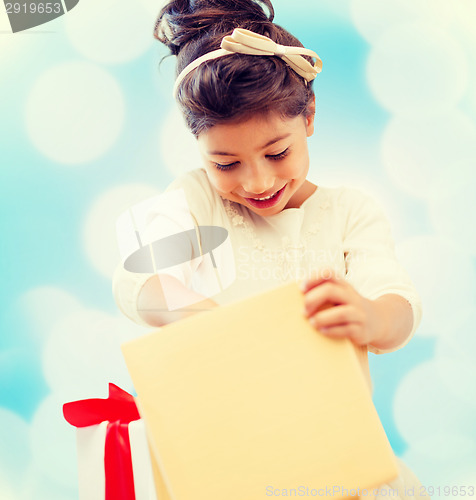 Image of happy child girl with gift box