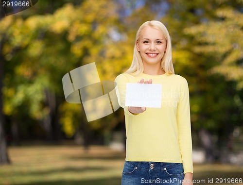 Image of smiling girl with blank business or name card