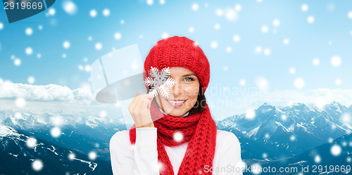 Image of smiling young woman in winter clothes