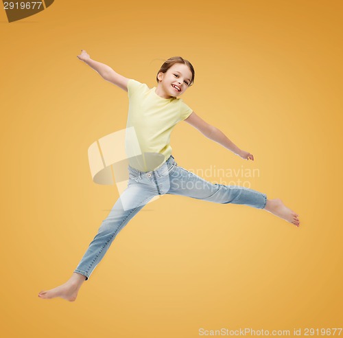 Image of smiling little girl jumping