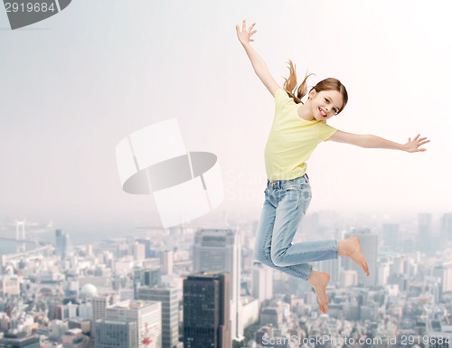 Image of smiling little girl jumping