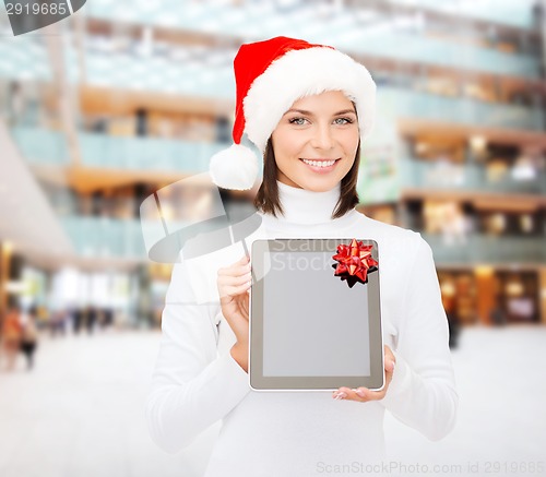 Image of woman in santa helper hat with tablet pc