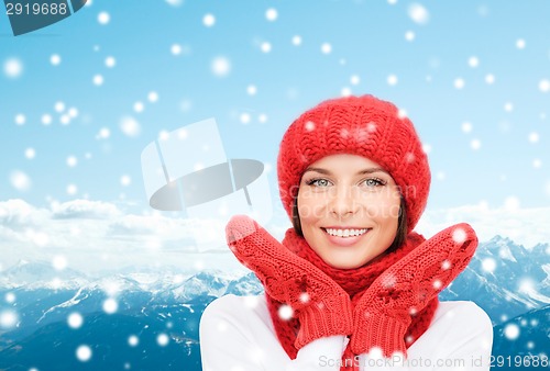 Image of smiling young woman in winter clothes