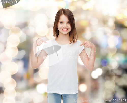 Image of smiling little girl in white blank t-shirt