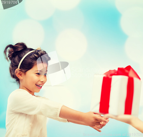 Image of happy child girl with gift box