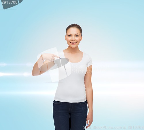 Image of smiling young woman in blank white t-shirt