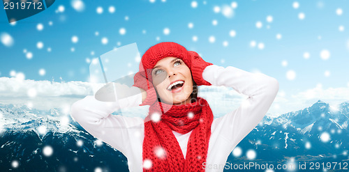 Image of smiling young woman in winter clothes