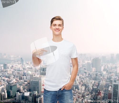 Image of smiling young man in blank white t-shirt