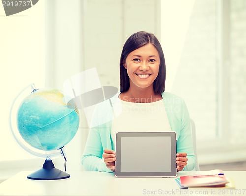 Image of teacher with globe and tablet pc at school