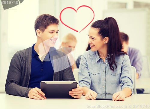 Image of students looking at tablet pc in lecture at school