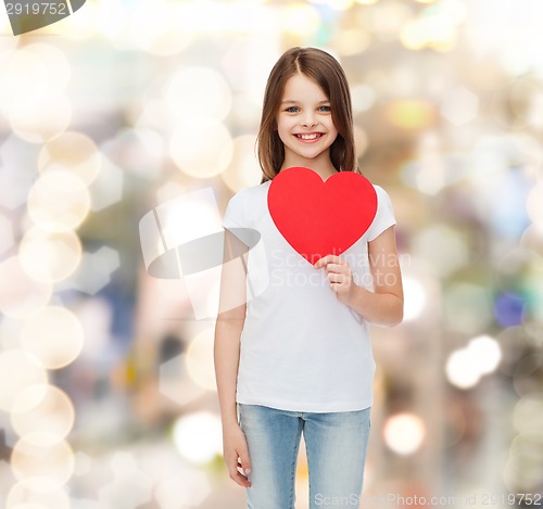 Image of beautiful little girl sitting at table