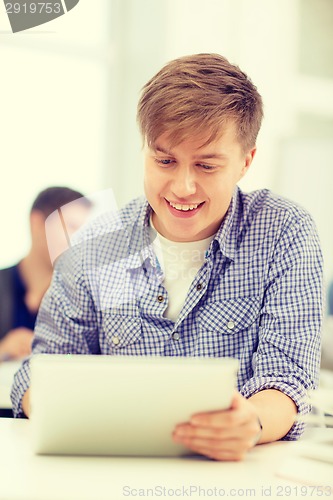 Image of smiling teenage student with tablet pc computer