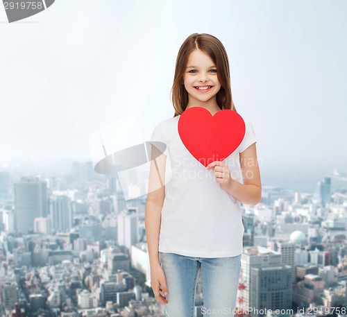 Image of smiling little girl in white blank t-shirt
