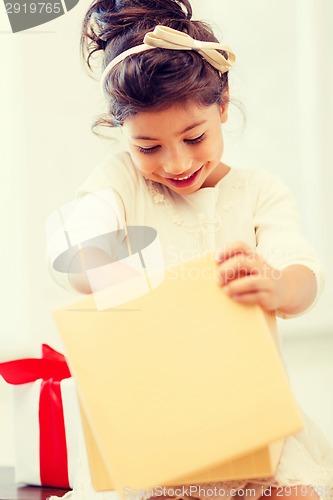 Image of happy child girl with gift box
