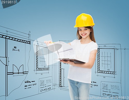 Image of smiling little girl in hardhat with clipboard