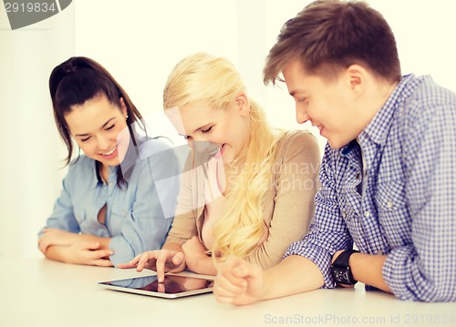 Image of smiling students with tablet pc computer at school