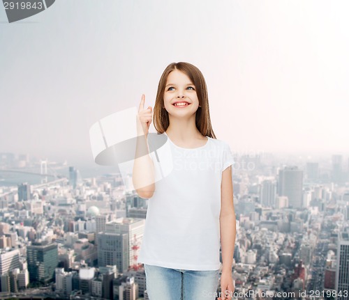 Image of smiling little girl in white blank t-shirt