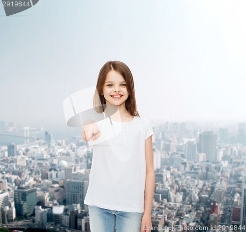 Image of smiling little girl in white blank t-shirt